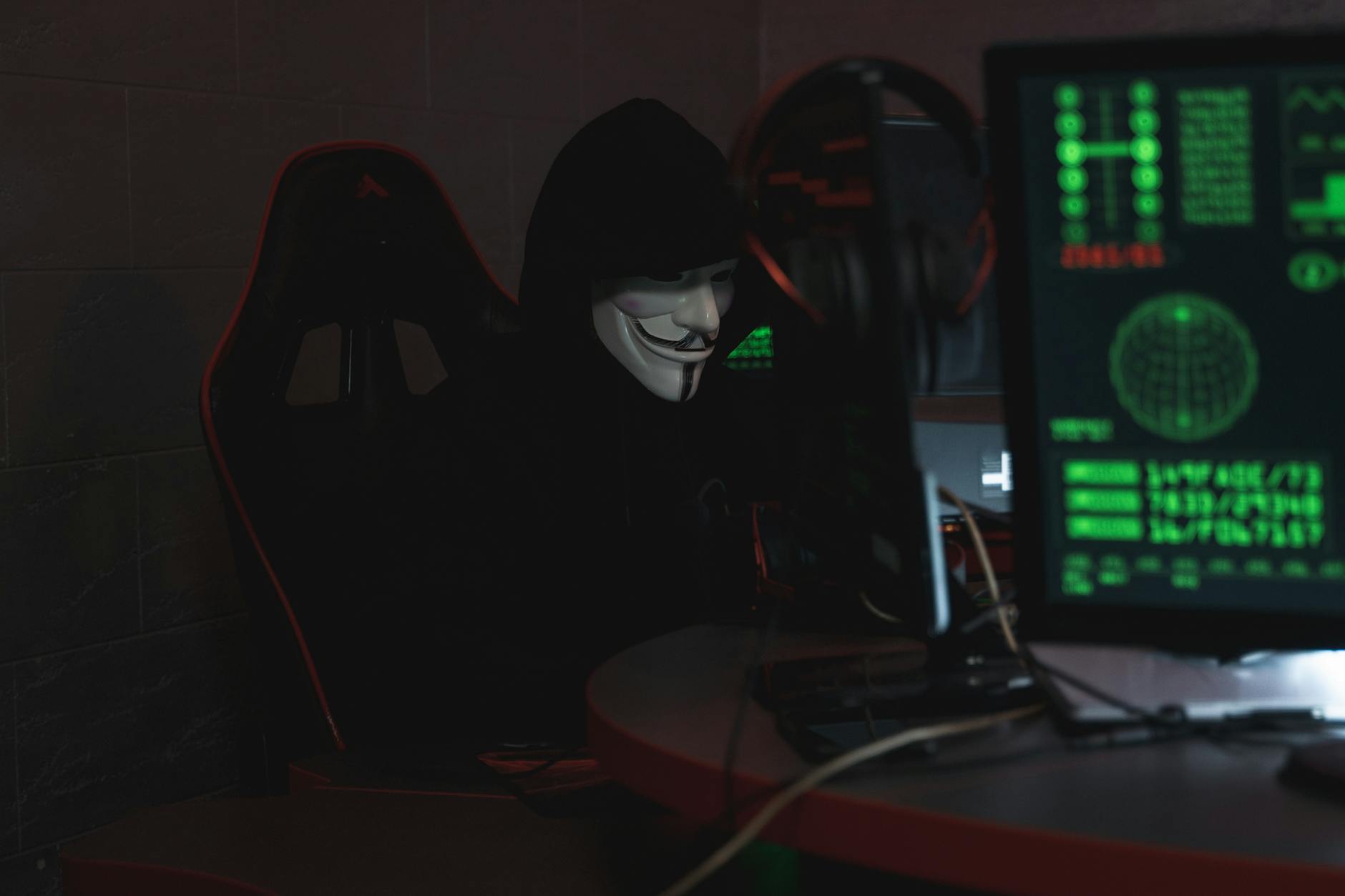 hacker silhouette dark room