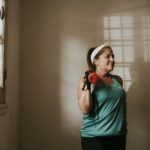 person exercising in modern gym