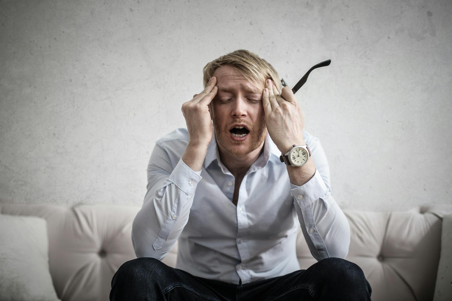 person frustrated with music app