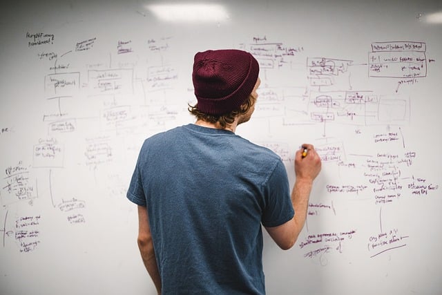 Developers discussing code with AI assistants on screens