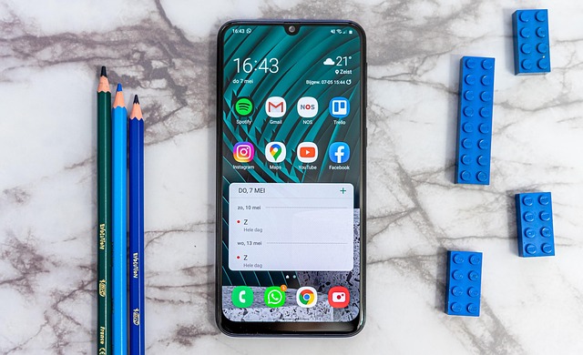 Google Pixel phone displaying a list of software update improvements with checkmarks. (google pixel update)