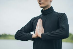 person meditating outdoors