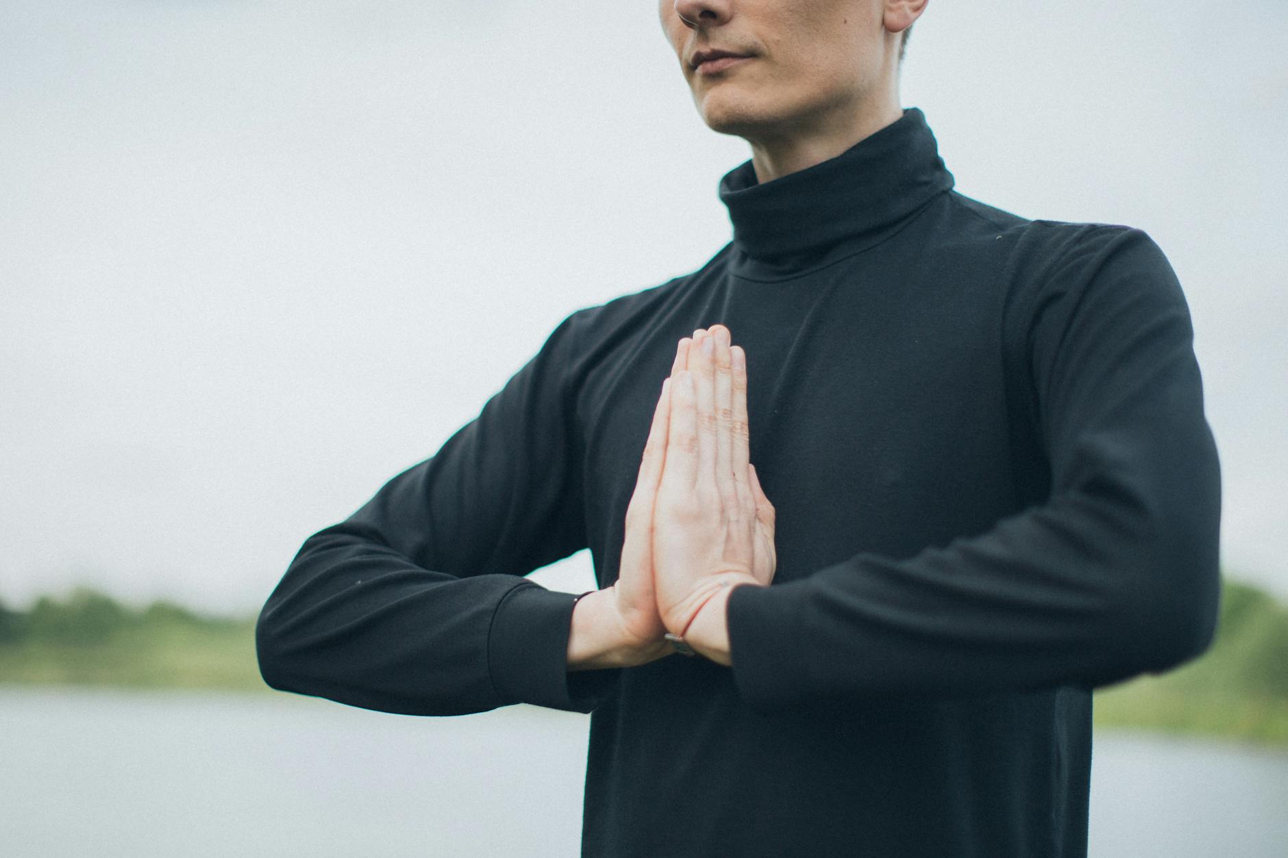 person meditating outdoors