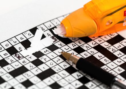 person thinking about crossword puzzle