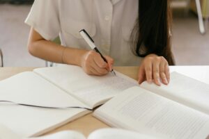 person writing a book