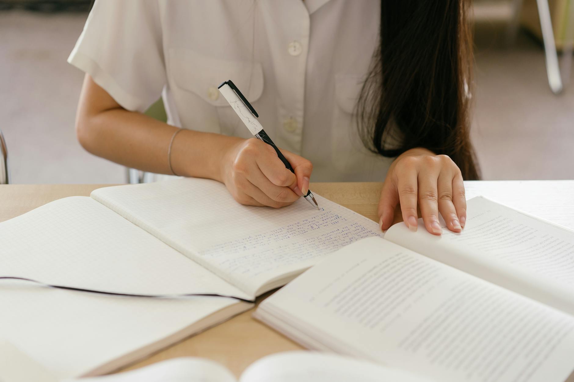 person writing a book