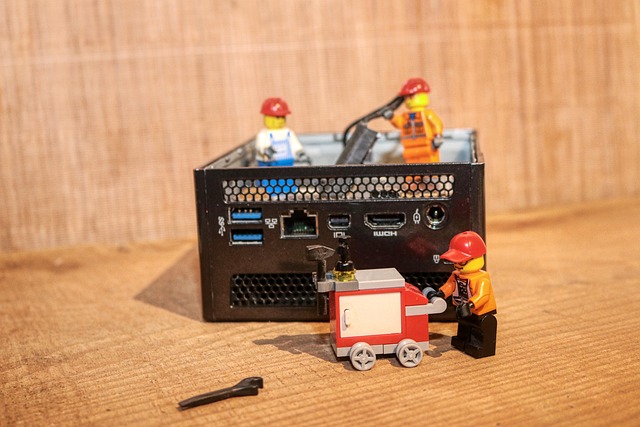 GM technician examining a car's infotainment system wiring (gm apple carplay retrofit kit removal)