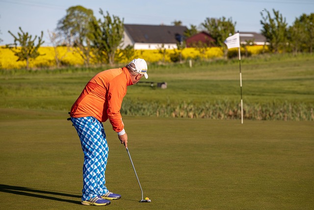 Beginner golfer comparing laser rangefinder reading to golf course pin