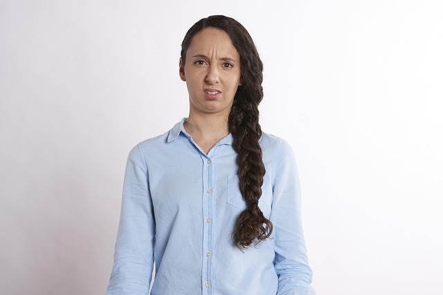 Illustration of a person looking confused at financial documents and a calculator