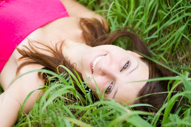 Woman smiling while walking on a scenic nature trail