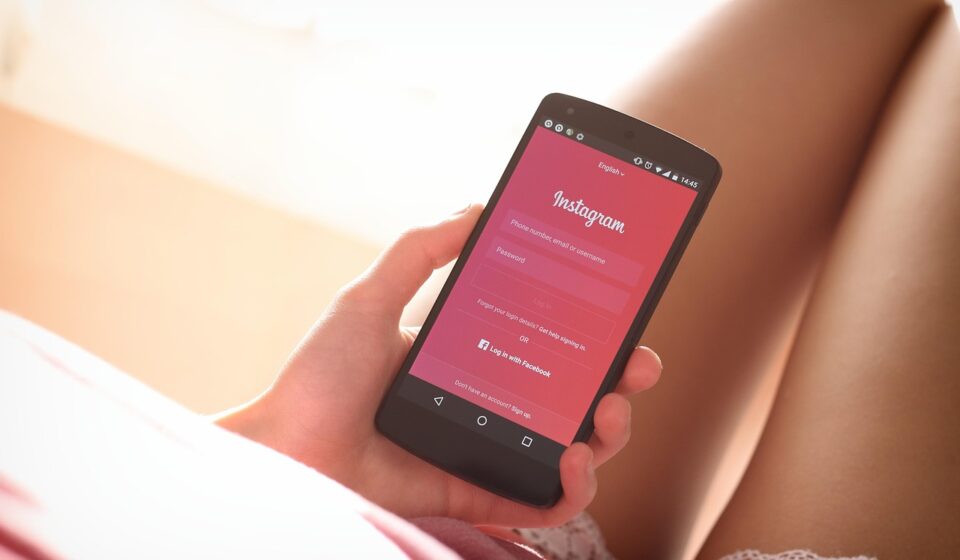 woman using period tracker app on phone